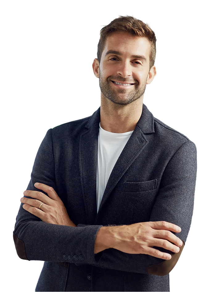Confident smiling man with arms crossed wearing a blazer against a white background