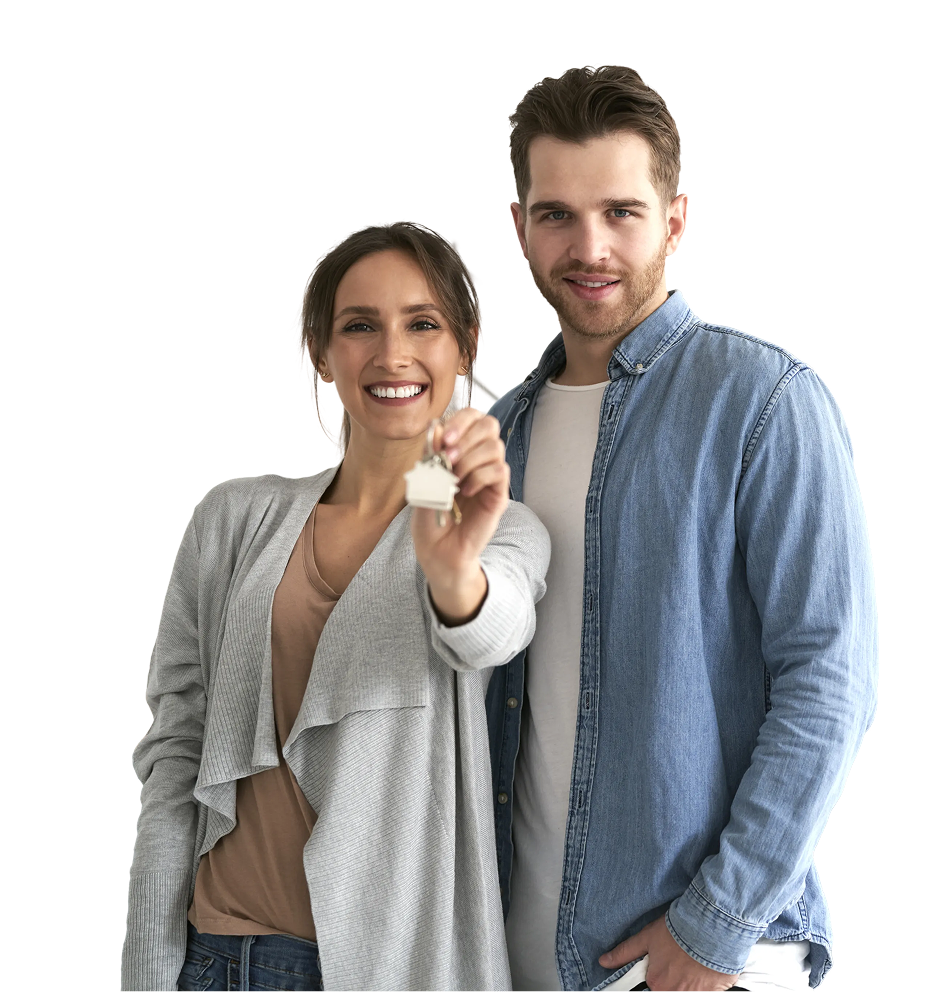Smiling young couple standing together as the woman holds up a new house key
