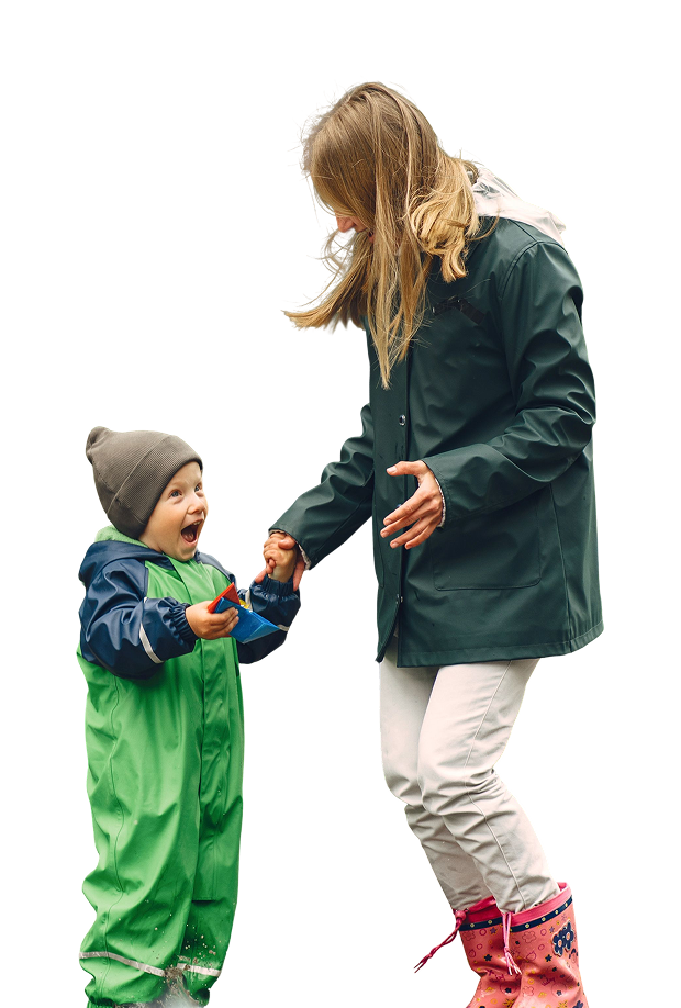 Happy mother and young child in rain gear playing together against a transparent background