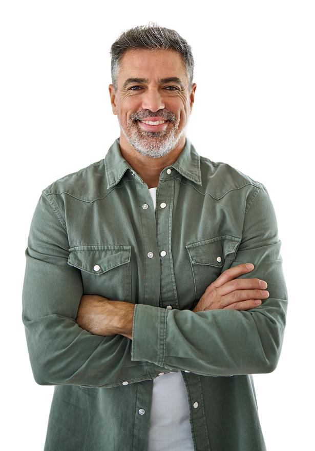 Smiling middle-aged man in a green shirt with arms crossed