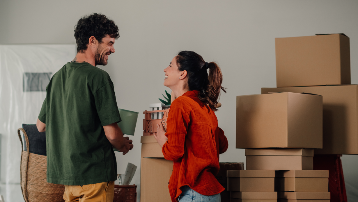 Cheerful Couple Moving into New Home Together